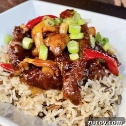 a plated dish of crispy chilli beef and rice