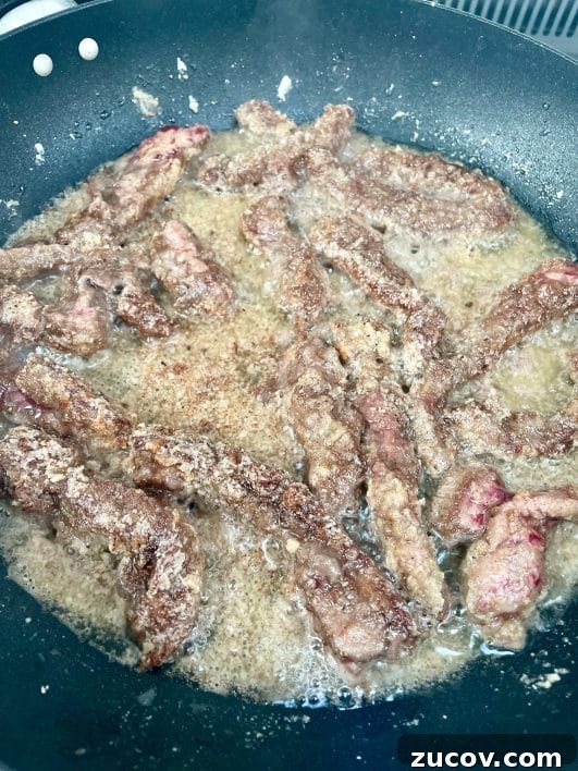 Crispy Chilli Beef Recipe: Crunchy, Spicy Takeout-Style Django 4 Frying beef strips
