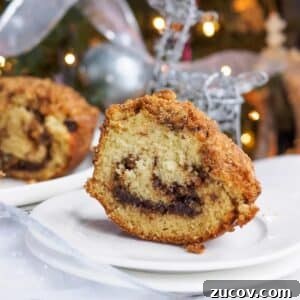 Decadent Chocolate Cinnamon Bundt Cake Recipe 7 Slice of chocolate cinnamon bundt cake on small dish.