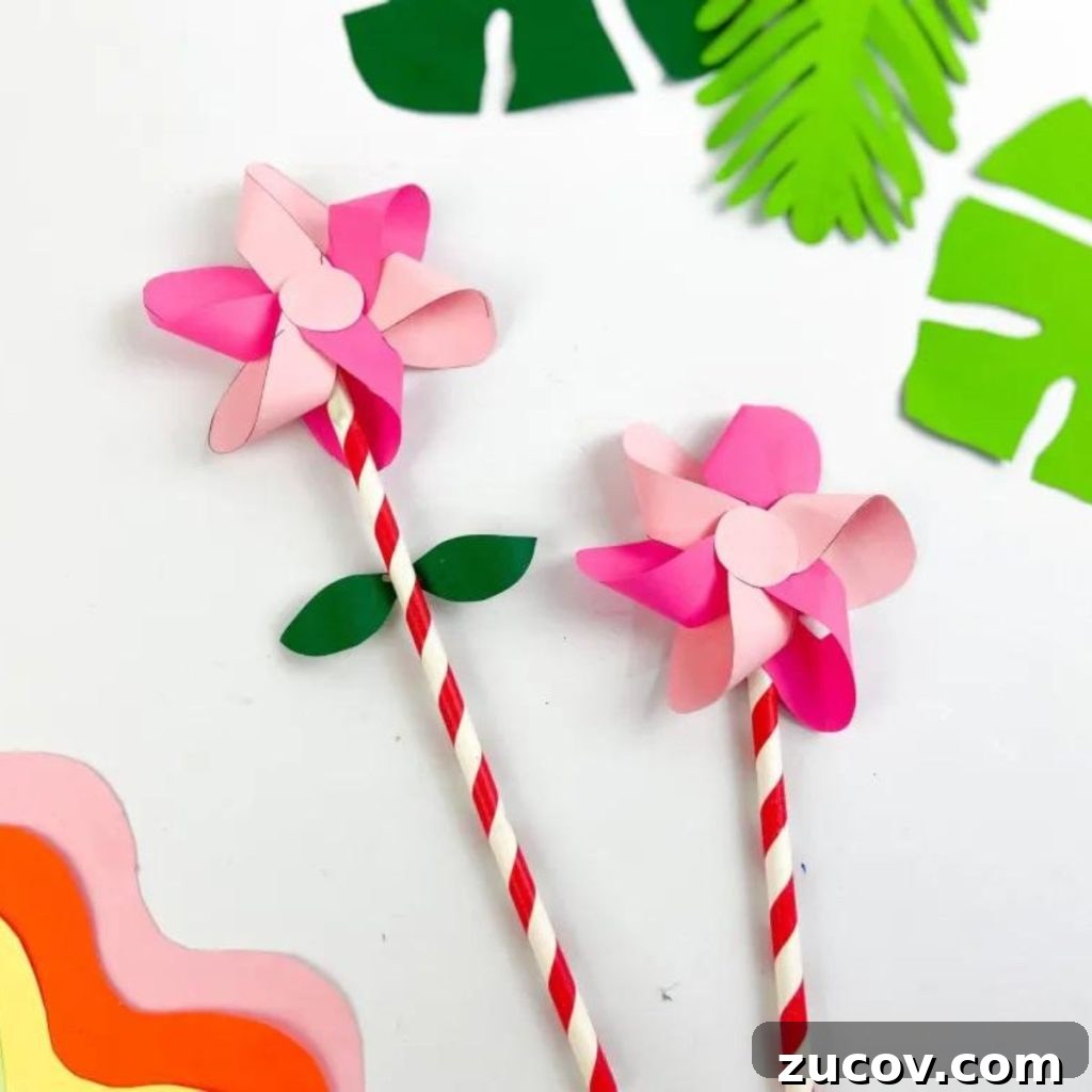16 Creative Paper Flower Crafts to Make This Spring 3 PINK SPRING FLOWER WITH LEAVES