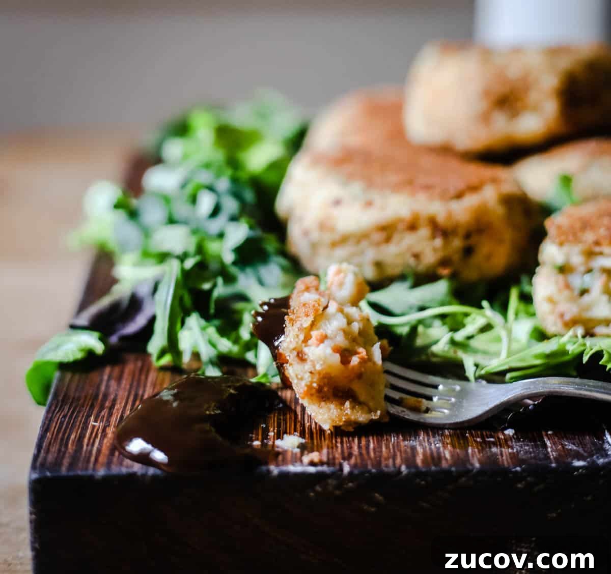 Gluten-Free Salmon Fishcakes Recipe: Crispy, Flavorful, Quick 5 Forkful of salmon fishcake infront of a pile of them.