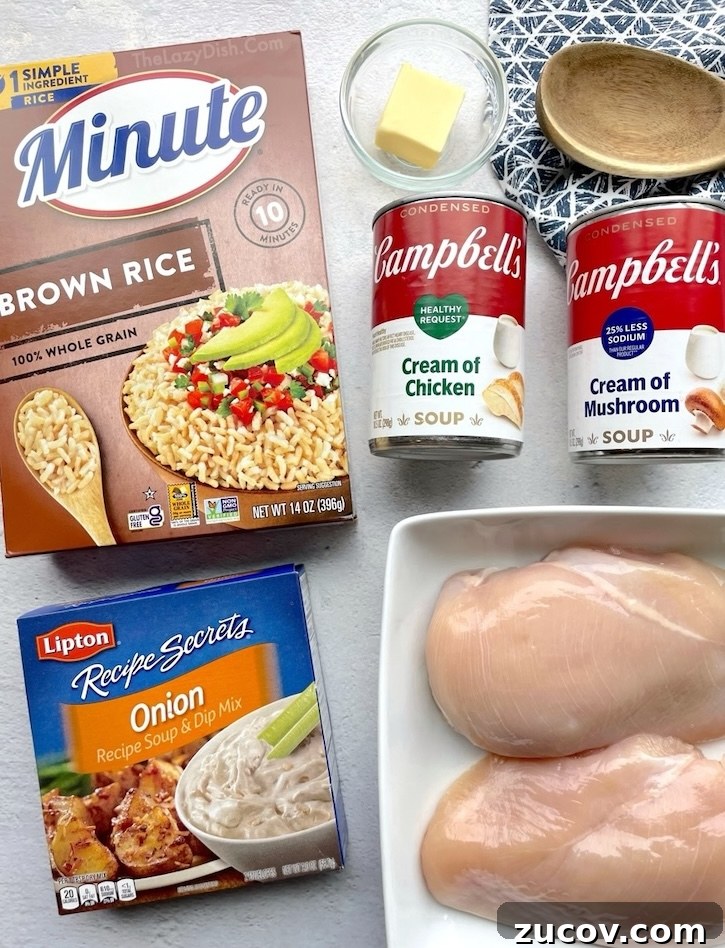 Creamy Chicken and Rice Casserole for a Relaxed Weeknight 4 Ingredients needed to make classic forgotten chicken recipe, an easy dinner casserole for large families: chicken breasts, Instant rice, cream of chicken soup, cream of mushroom soup, butter, and an onion soup mix seasoning packet.