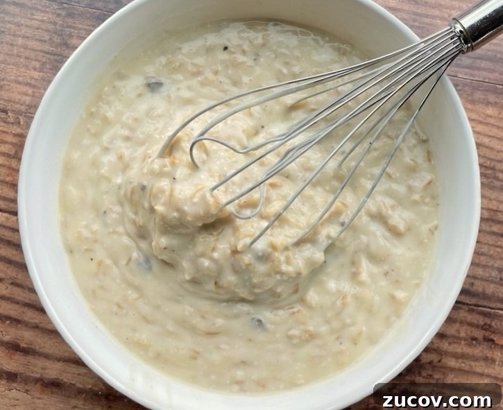 Creamy Chicken and Rice Casserole for a Relaxed Weeknight 5 Instant rice and a few cans of cream soup mixed together in a bowl to make a creamy chicken dinner casserole.