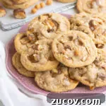 Twix Cookie Recipes: Homemade Bars and Crunchy Bites 6 Twix bar cookies stacked on a plate in front of a wire rack with more cookies