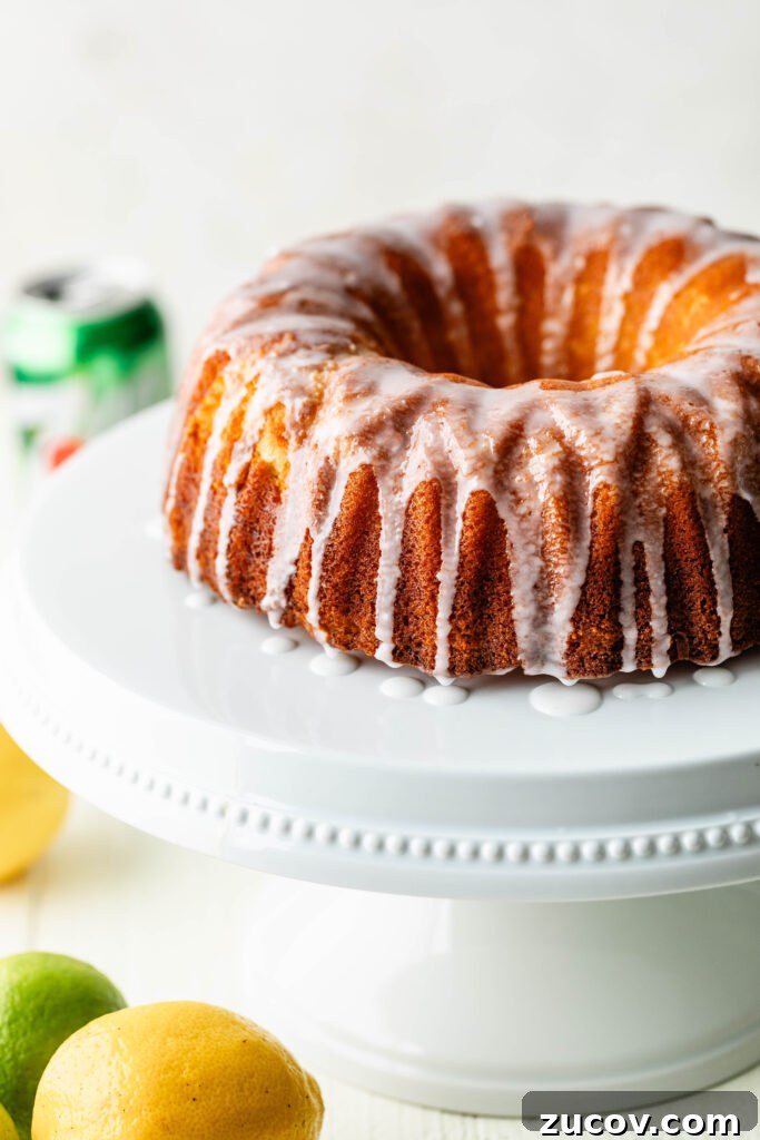 7-Up Pound Cake Recipe: Classic Southern Soul Food Treat 3 7-up pound cake on white cake stand with lemons and limes