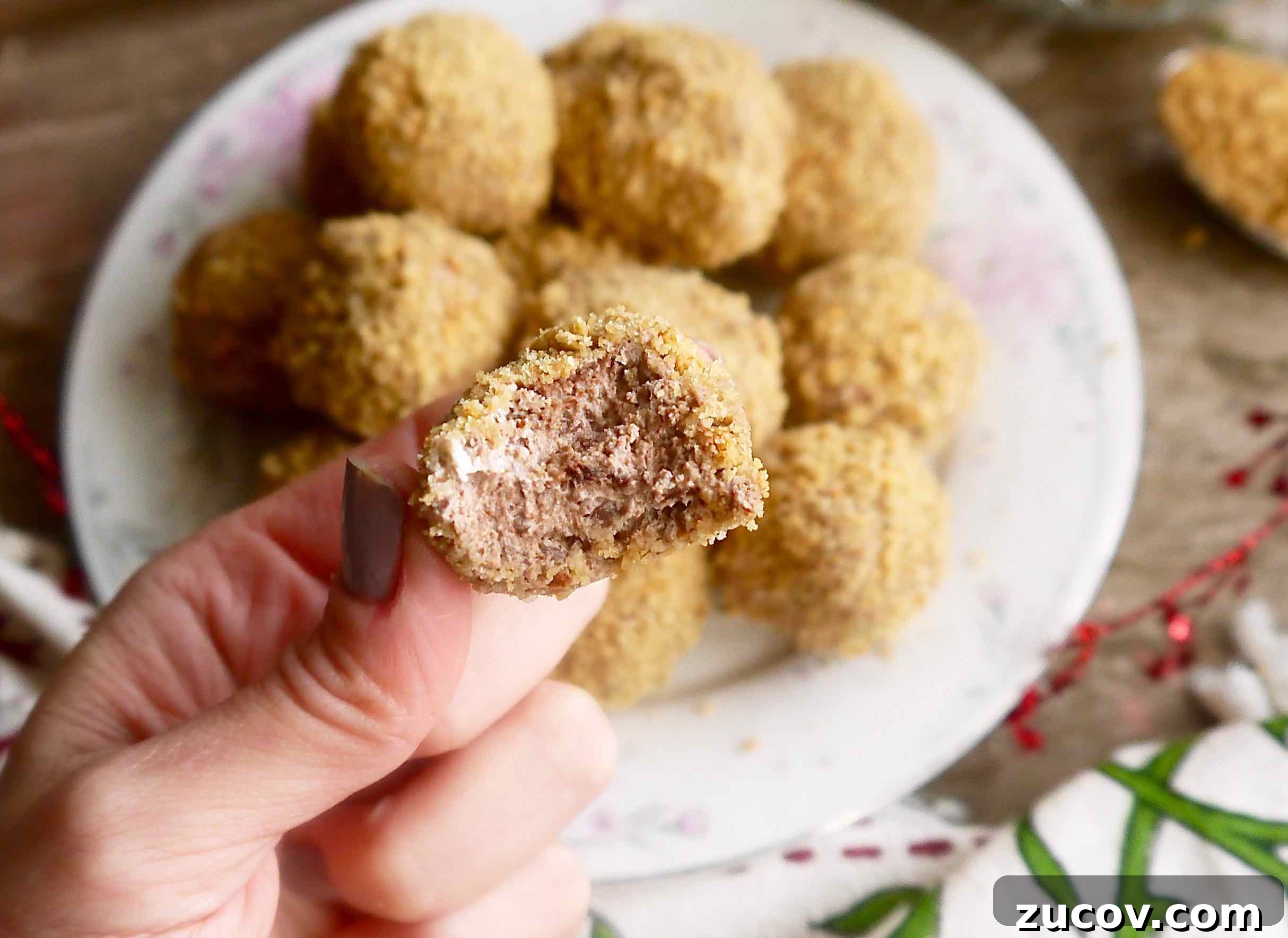 Paleo Chocolate Mousse Truffles Recipe for Decadent Snack 14 A bite taken out of a chocolate mousse truffle.