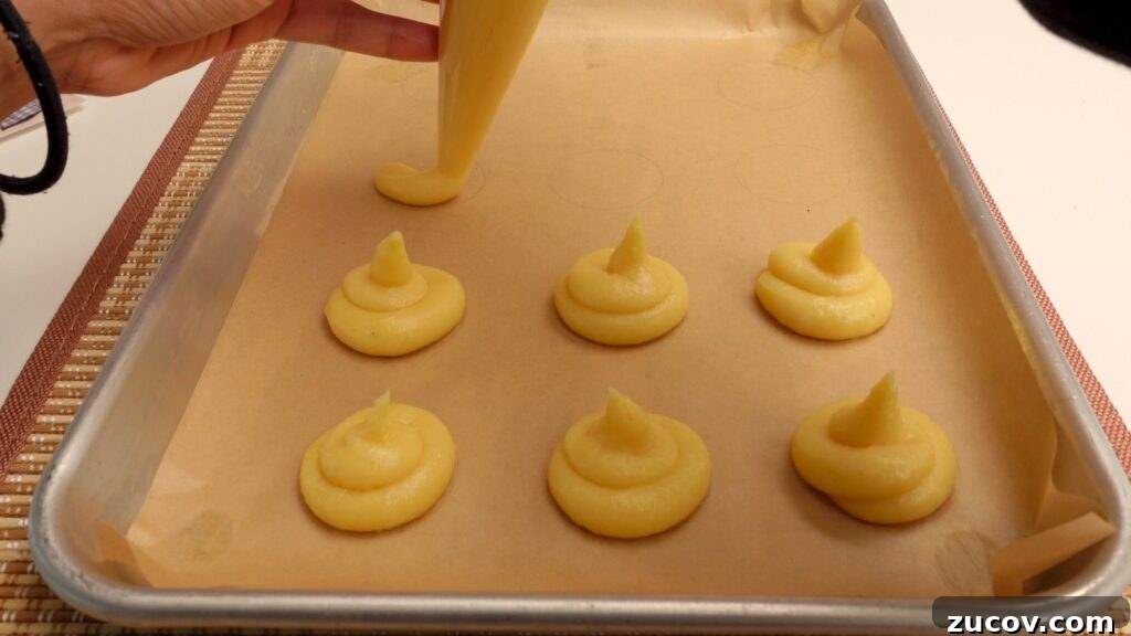 Ube Cream Puffs: Filipino Purple Yam Pastry Recipe 10 Piped choux on a baking tray