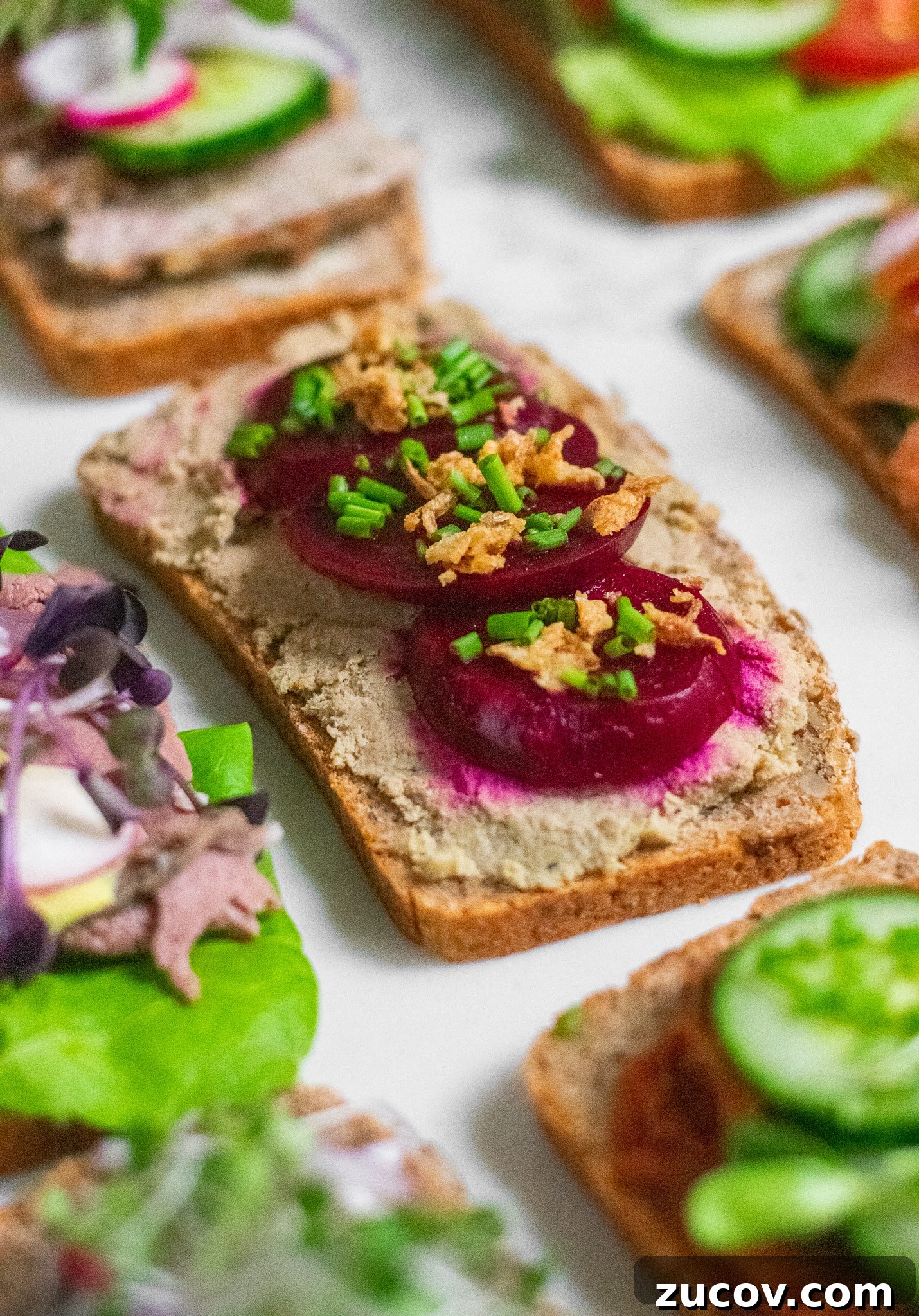 How a Sandwich Became Denmark’s Iconic Smørrebrød: Complete Guide 15 A rye bread open faced sandwich topped with liver pate, pickled beets, and fried onions.