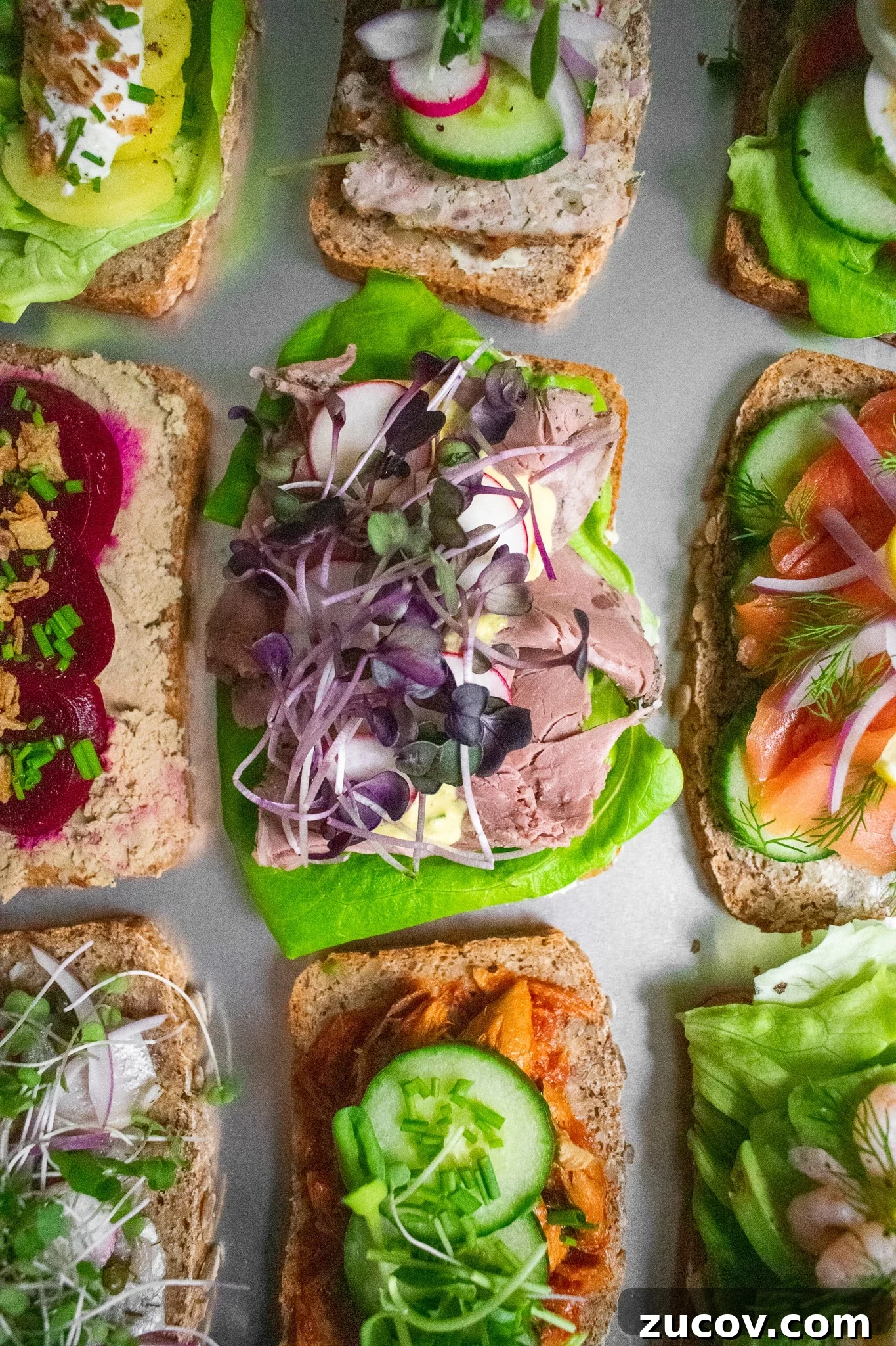 How a Sandwich Became Denmark’s Iconic Smørrebrød: Complete Guide 7 Danish open faced sandwiches on a platter.