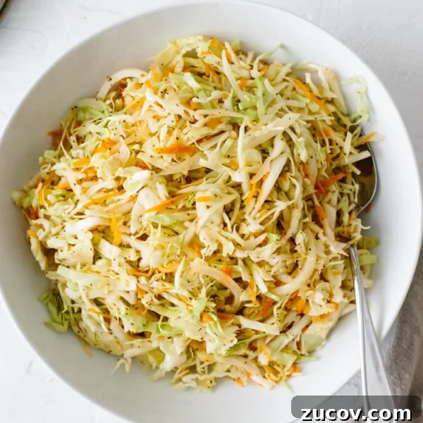Vinegar coleslaw in a white bowl.