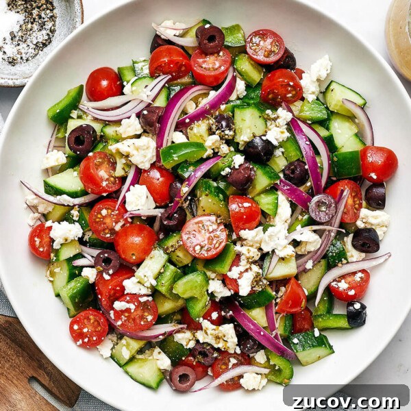 A white bowl of Greek salad