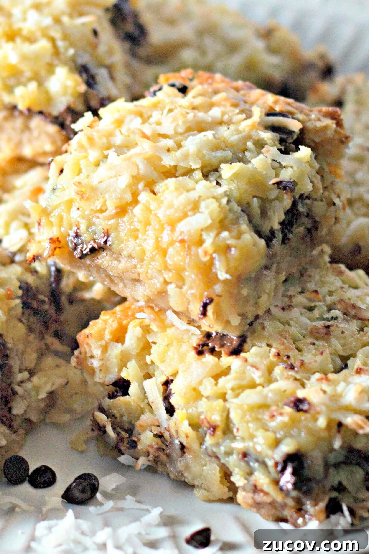 Coconut Butter Bars Recipe with Creamy Coconut Filling 11 Coconut butter bars stacked on top of each other.