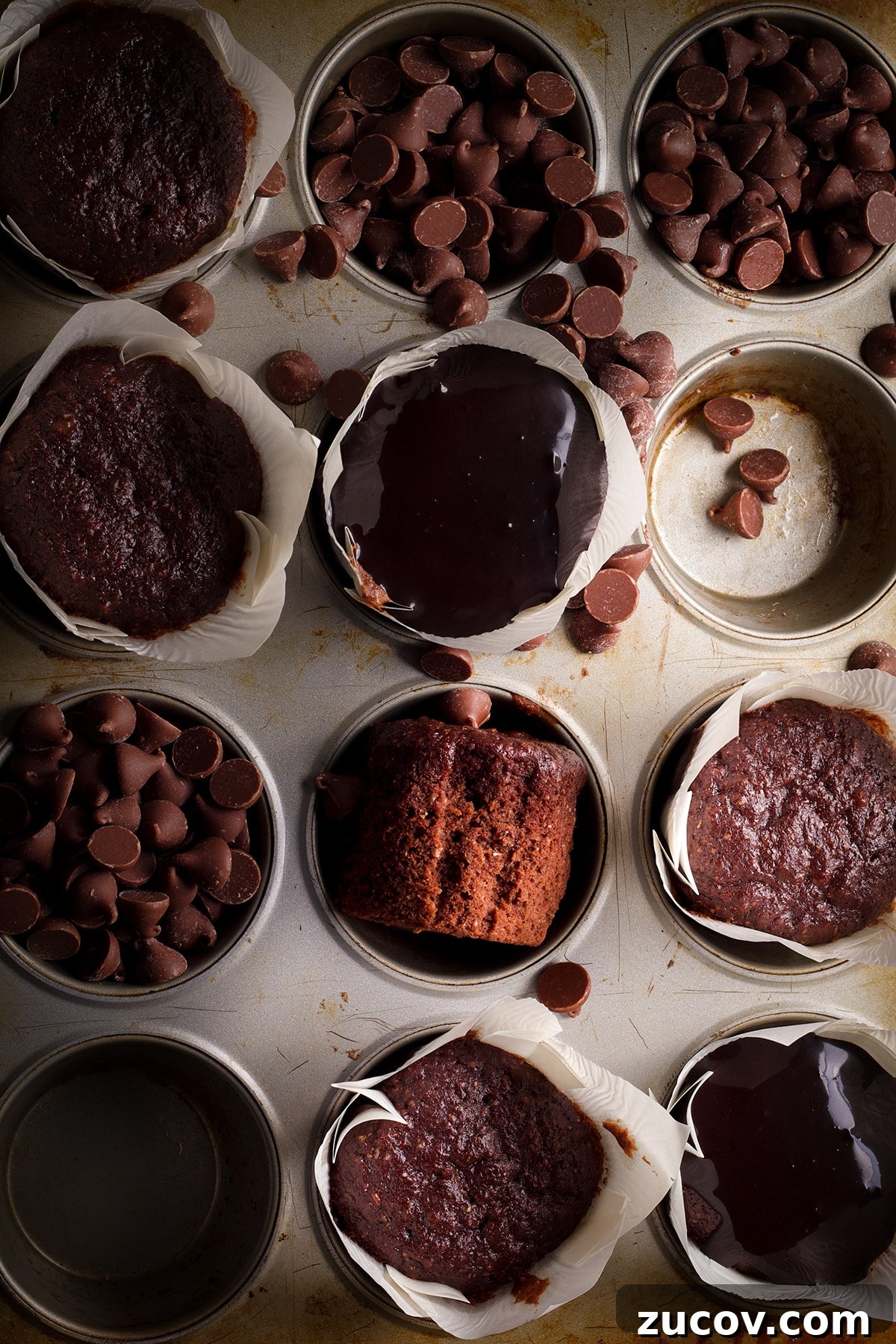 Chocolate Banana Muffins with Oats and Dark Cocoa 5 A muffin tray filled with chocolate banana muffins, some covered with chocolate glaze and some unglazed.